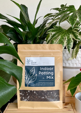 Load image into Gallery viewer, The Home Plant Co potting mix in 3 litre bag with pots and plants in background
